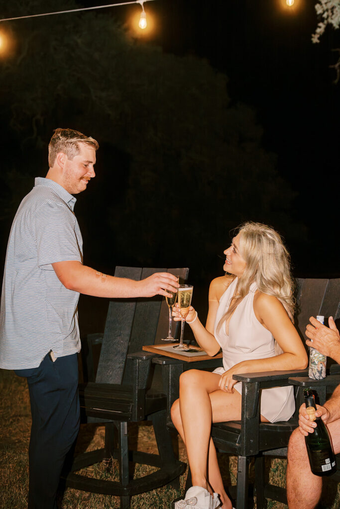 under the oaks, texas wedding venue, wedding rehearsal, texas bride, one more night, shiner texas, oak trees, bistro lights, dinner set up, outdoor dinner set up